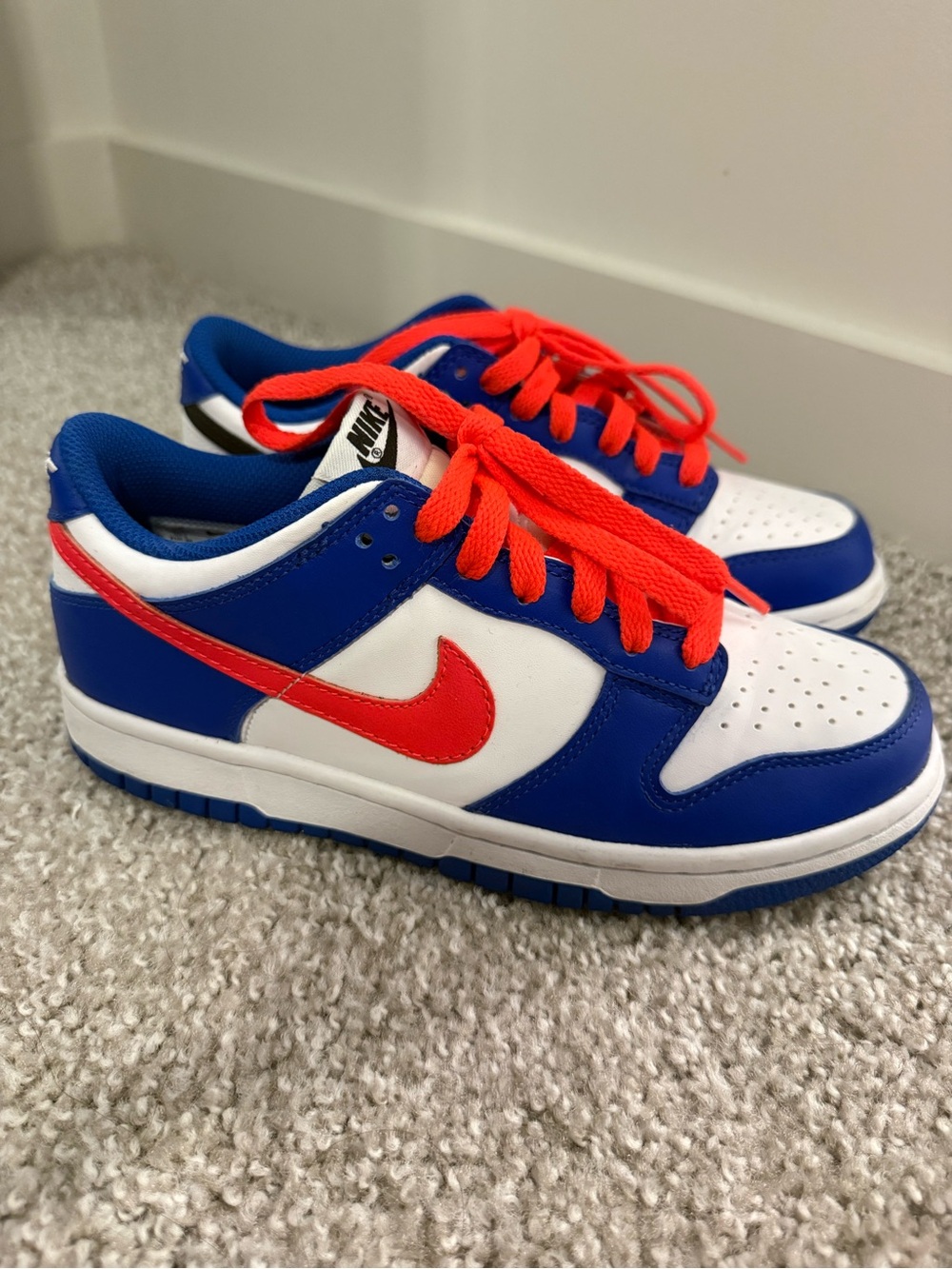 Nike Kids Low Top Sneakers in White, Royal Blue & Bright Red